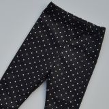 Zateplené elastické softshellové legíny tečky na černé vel. 122