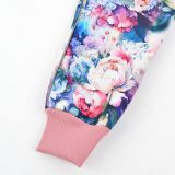 Zimní softshellové kalhoty barevné květy - klasický střih vel. 146